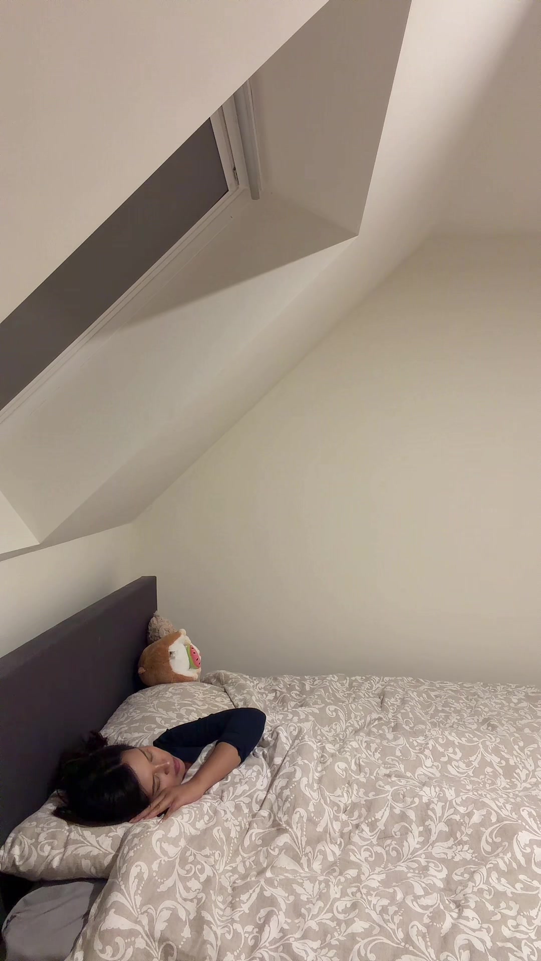 Ash sleeping peacefully in her bed