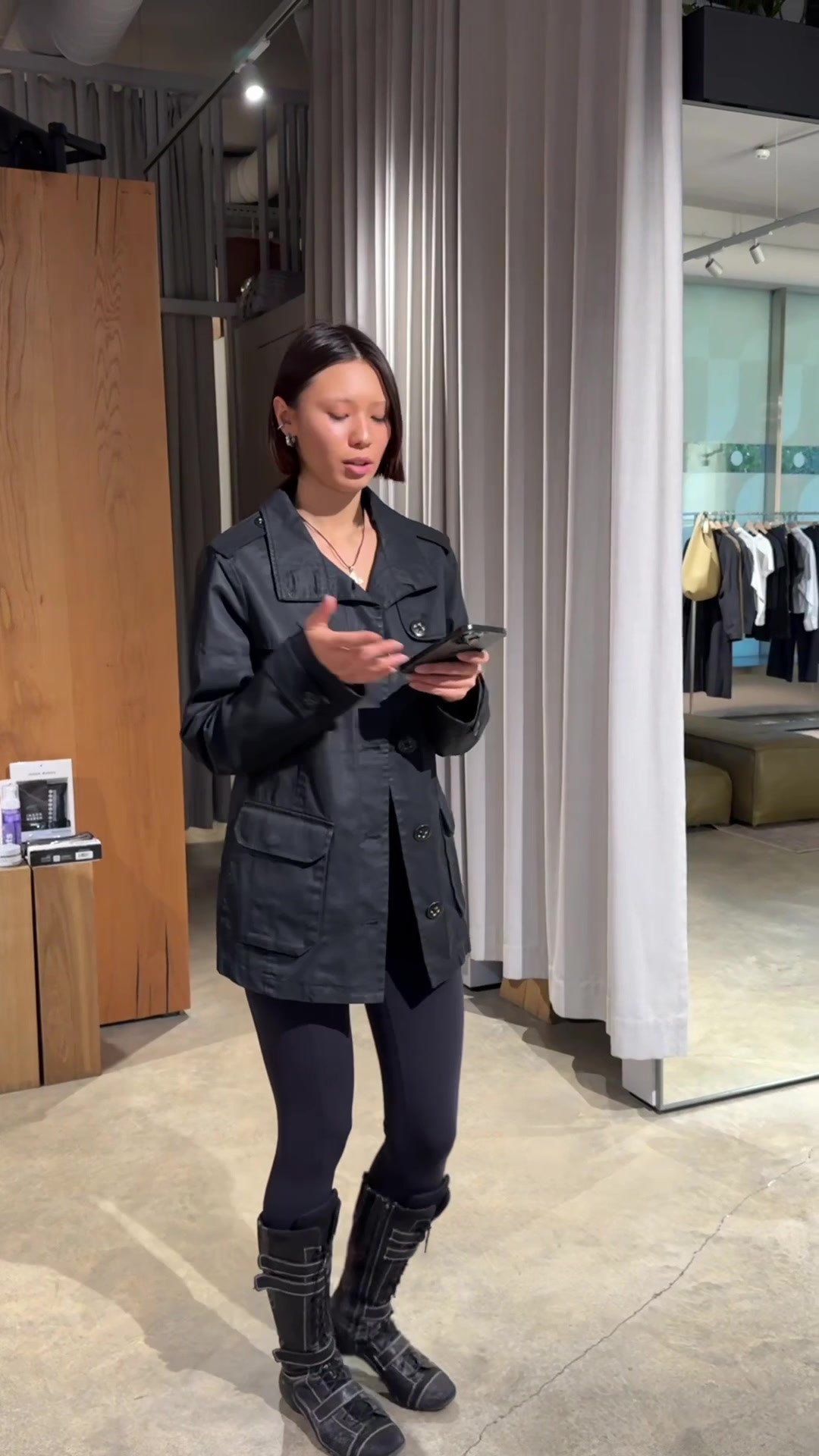Woman Pacing While Looking at Phone