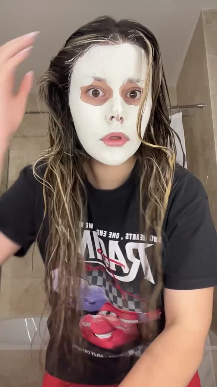 Woman with Face Mask Styling Damp Hair