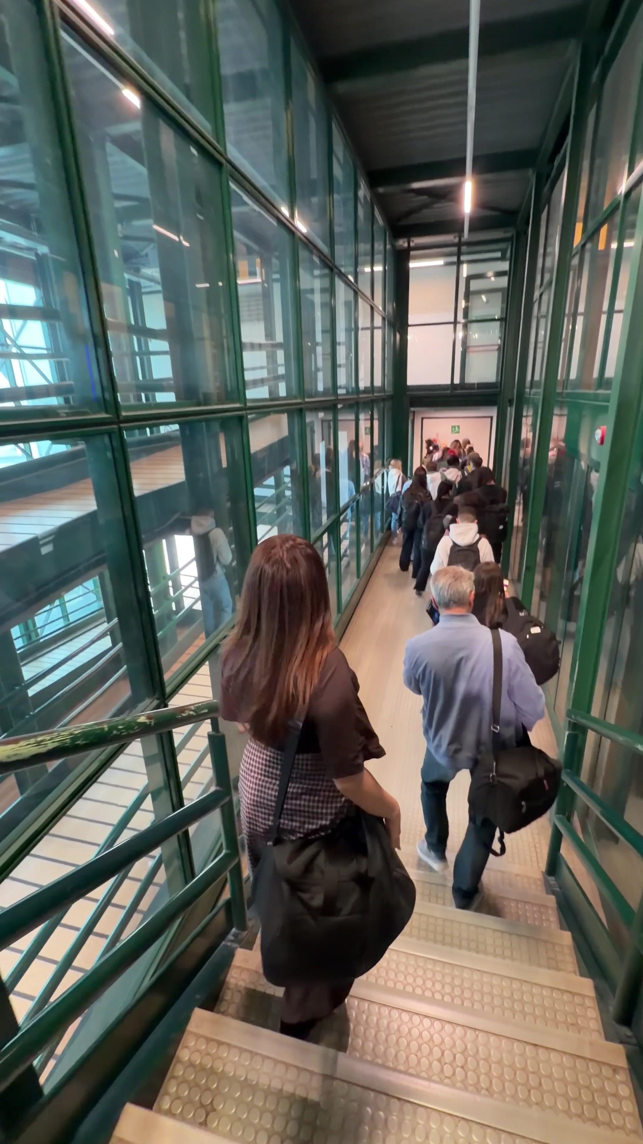Woman Walking Down Airport Gangway Corridor