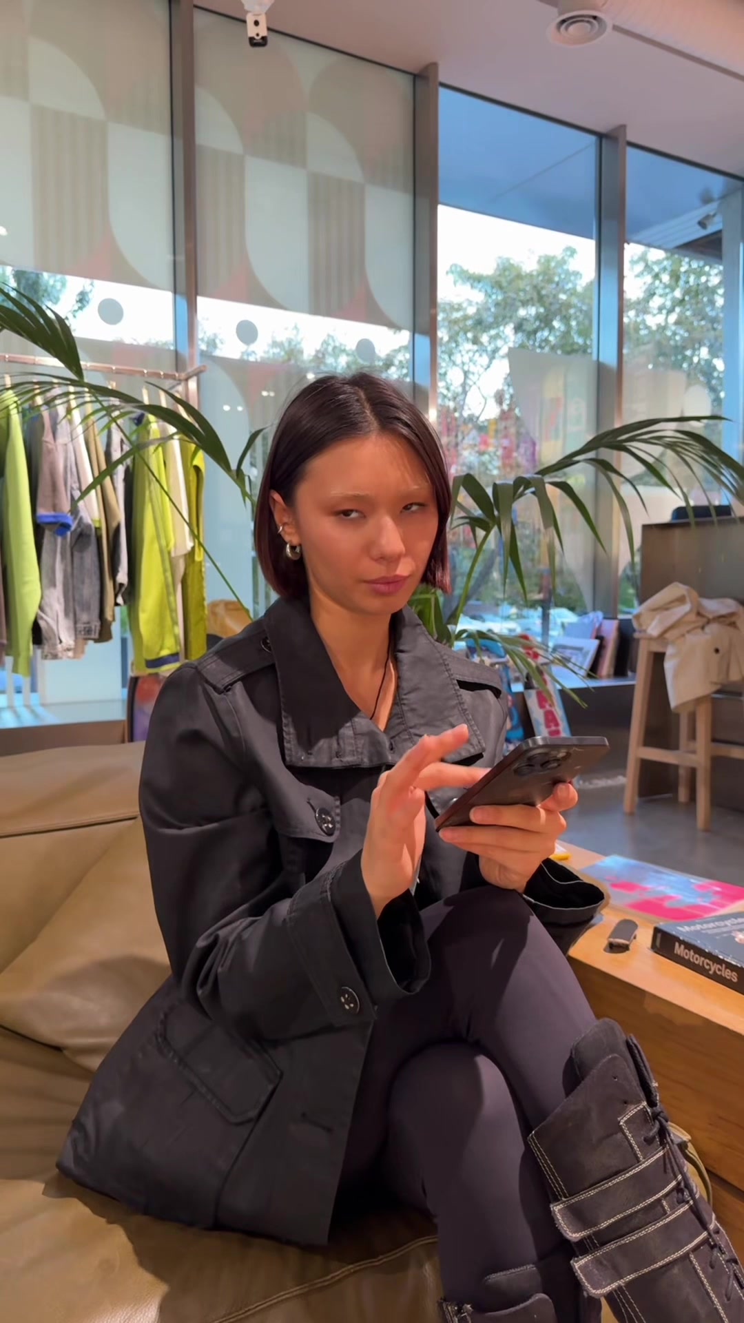 Thoughtful Woman Pondering Over Her Smartphone