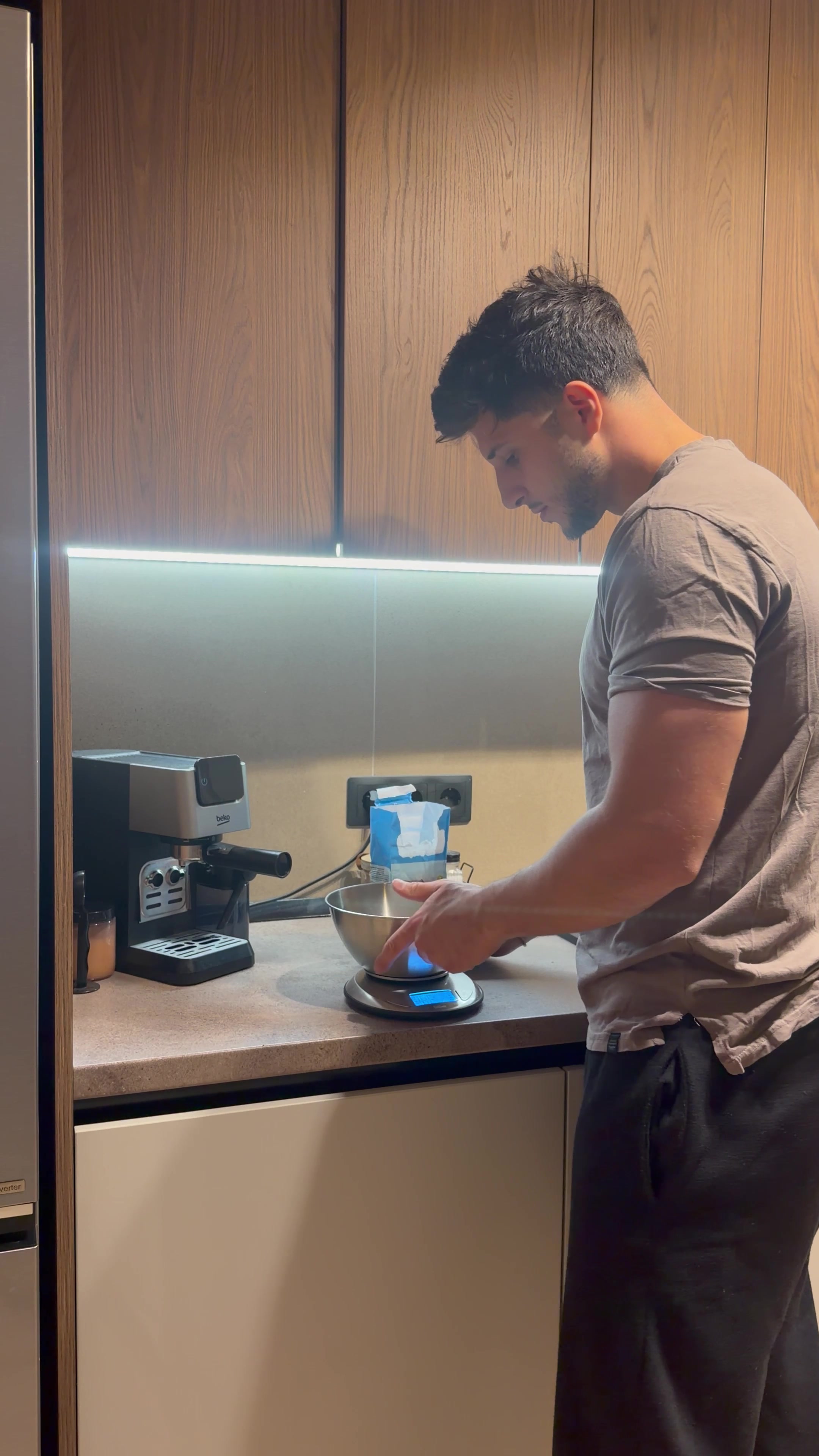 Man Weighing Oats on Kitchen Scale