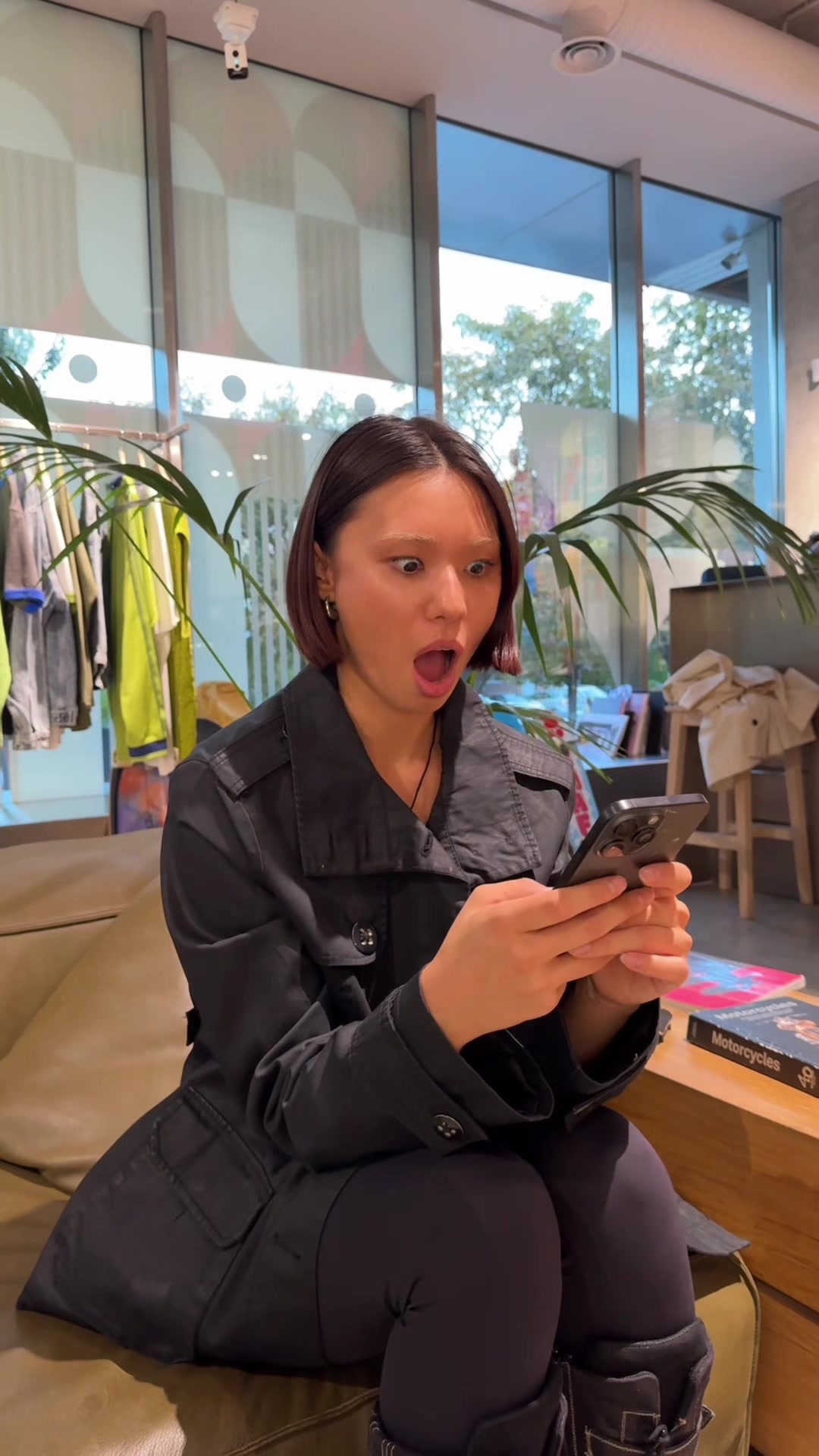 Woman Shocked While Looking at Phone