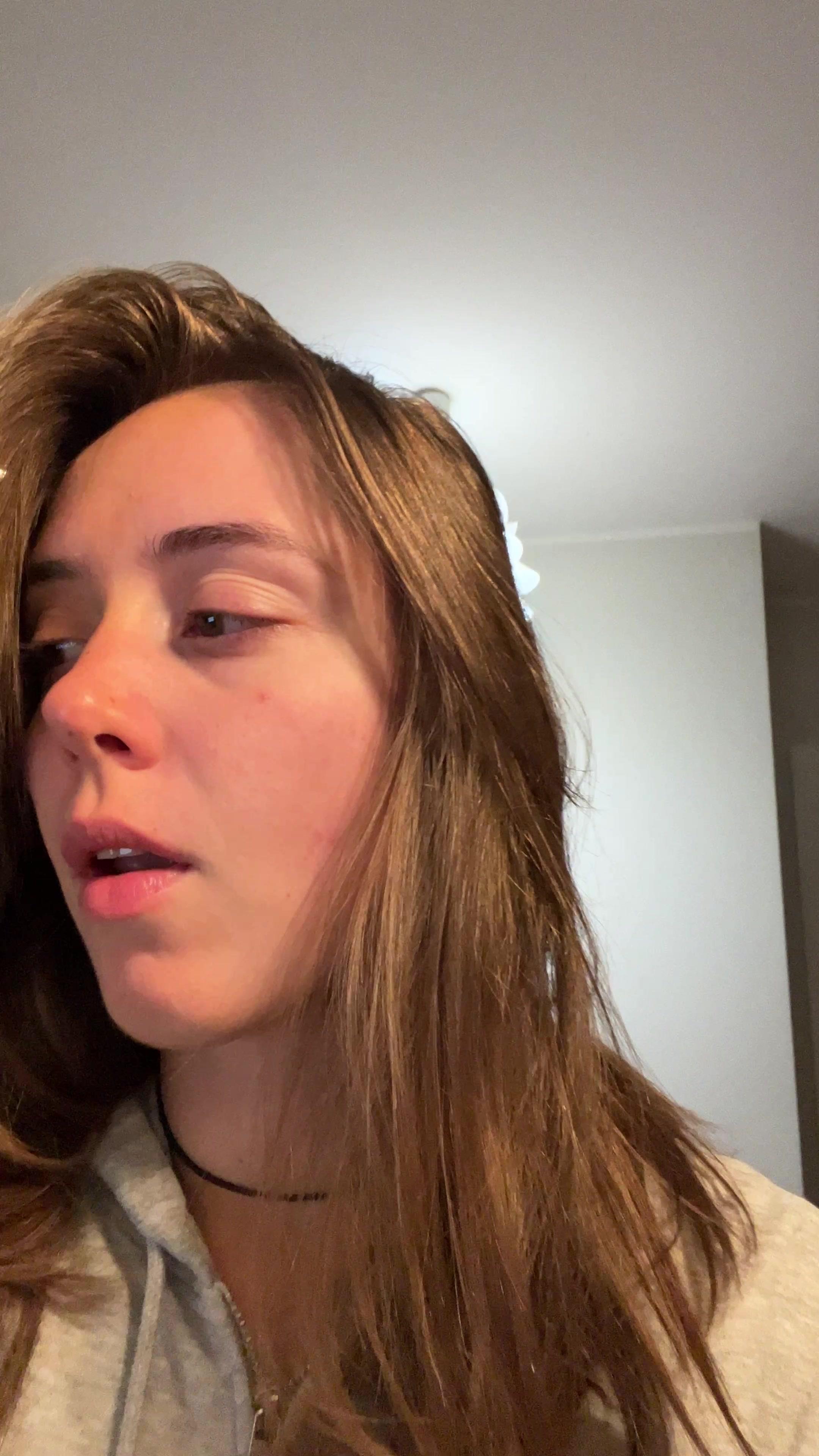 Tired Young Woman Rubbing Her Eye