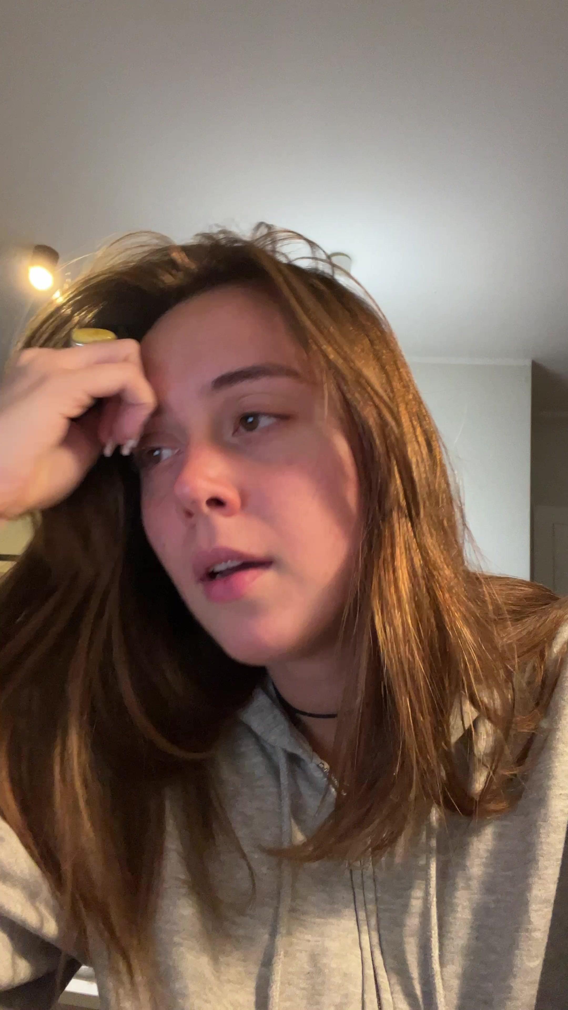 Young Woman Yawning and Looking Tired