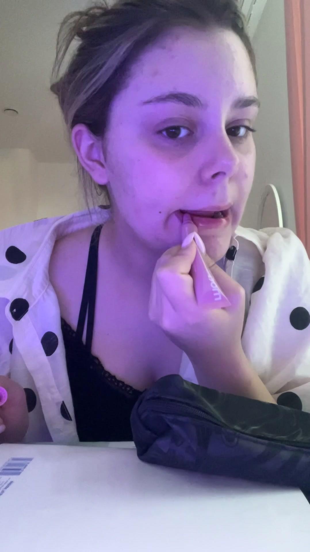 Young Woman Applying Makeup and Breaking Down