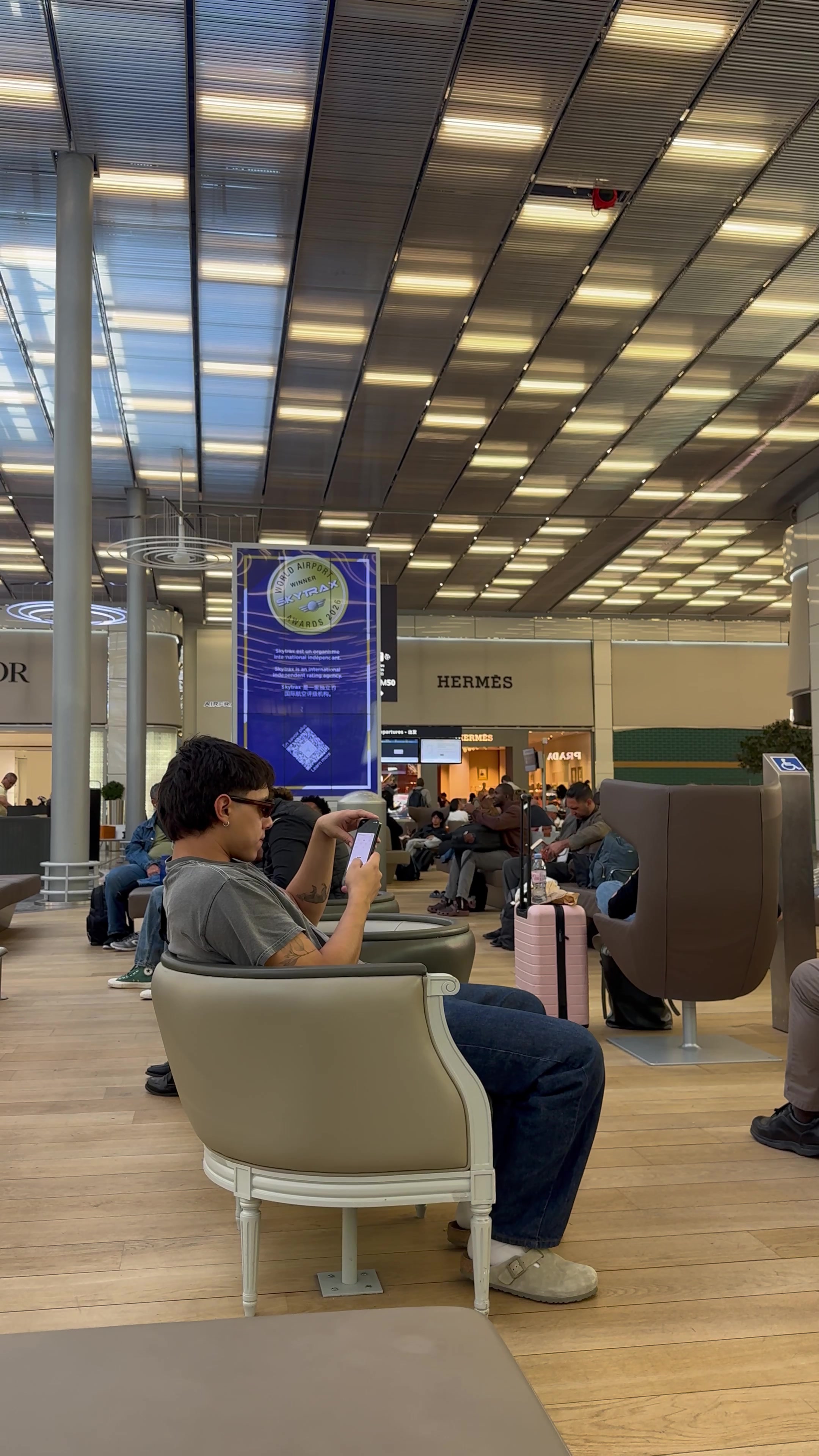 Young Man Waiting in Airport Terminal
